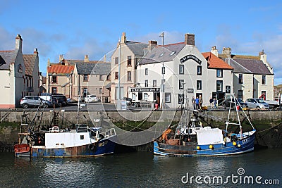 Fishing boats quayside Contented Sole, Eyemouth Editorial Stock Photo
