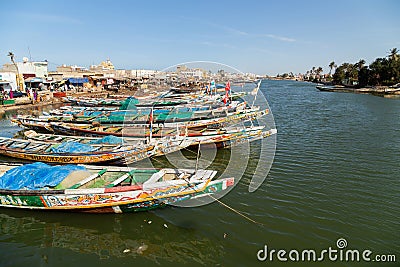 Fishing boats resting on the riverbank of the river senegal Editorial Stock Photo