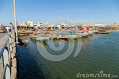 Fishing boats resting on the riverbank of the river senegal Editorial Stock Photo