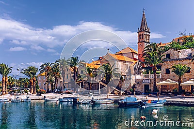 Fishing boats in Splitska village with beautiful port, Brac island, Croatia. Village of Splitska on Brac island seafront view, Stock Photo