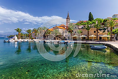 Fishing boats in Splitska village with beautiful port, Brac island, Croatia. Village of Splitska on Brac island seafront view, Stock Photo