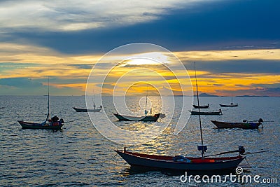 Fishing boats at sunset Stock Photo