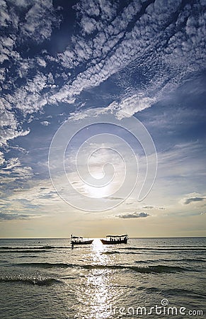 Fishing boats at sunset in koh rong Cambodia Stock Photo