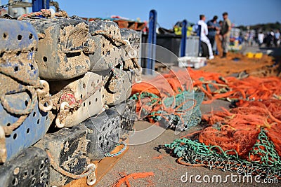 Fishing boxes and colorful fishing nets at the fishing Harbor in Whitstable, UK Stock Photo