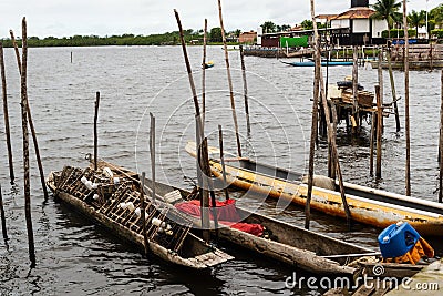 Fishing canoes docked on the Almas River in the city of Taperoa, Bahia Editorial Stock Photo