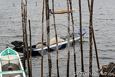 Fishing canoes docked on the Almas River in the city of Taperoa, Bahia Stock Photo