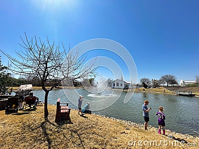 Fishing event at church pond in sunny Spring day at Southlake, Texas, America Editorial Stock Photo