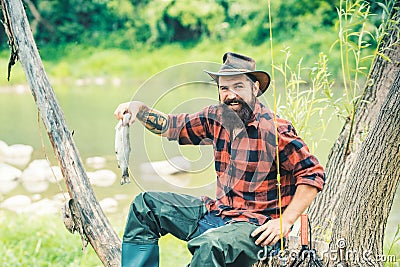 Fishing hobby and summer weekend. Bearded men fisher with fishing rod. Stock Photo