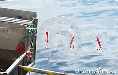 Fishing Hooks on a line on a Fishing boat tide up in harbour in Ireland c Stock Photo