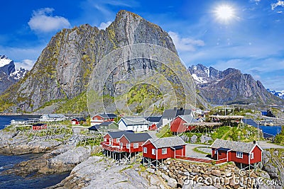 Fishing hut rorbu in the Hamnoy and Lilandstinden mountain In Background, Reine, Lofoten islands, Norway Stock Photo