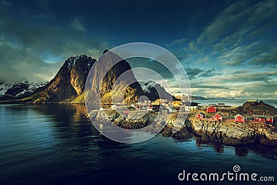 Fishing hut at spring sunset - Reine, Lofoten islands Stock Photo