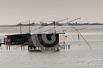 Fishing lodges and balancing nets in Comacchio, Italy. Stock Photo