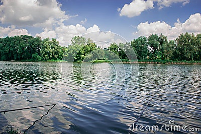 Fishing in the morning on the pond. Vacation, outdoor recreation. Stock Photo
