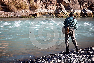 Fishing on mountain river Stock Photo