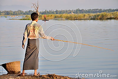 Fishing near the U Bein Bridge Editorial Stock Photo