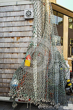 Fishing net and accessories hanging on a hut Editorial Stock Photo