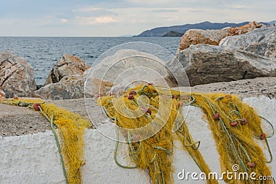 Fishing nets on a concrete pier by the sea Stock Photo