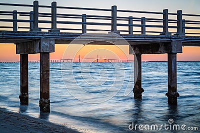 Fishing Pear frames the skyway bridge from Fort DeSoto in Florida Stock Photo