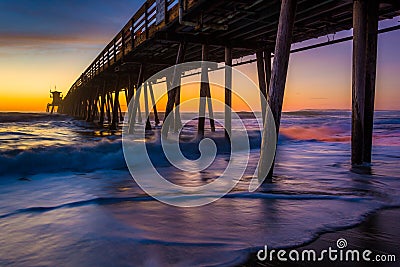 The fishing pier seen after sunset in Imperial Beach, California Stock Photo