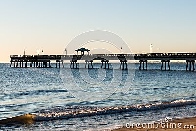 Fishing Pier with Waves at Buckroe Beach Stock Photo