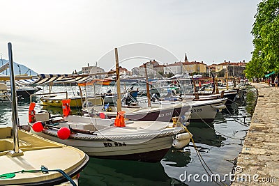 Fishing and pleasure boats are in the bay. Budva Editorial Stock Photo