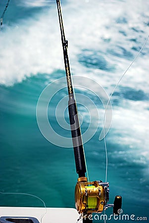 Fishing pole over the water Stock Photo