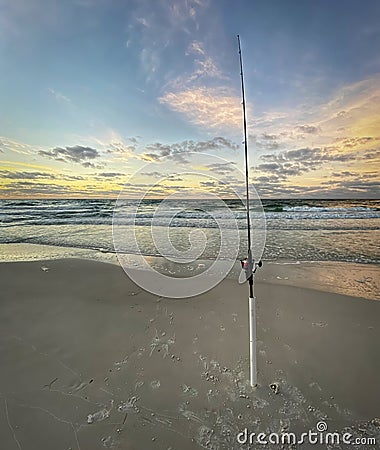 Fishing pole in Sand. Shore fishing. Stock Photo