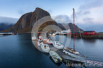 Fishing port and red rorbuer at Hamnoy fishing village in the morning Editorial Stock Photo