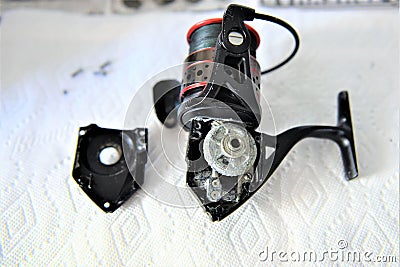 Fishing reel cause malfunction without cover Stock Photo