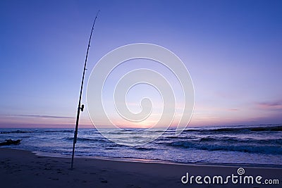 Fishing rod on the beach Stock Photo