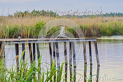 Fishing rod on a old pontoon Stock Photo