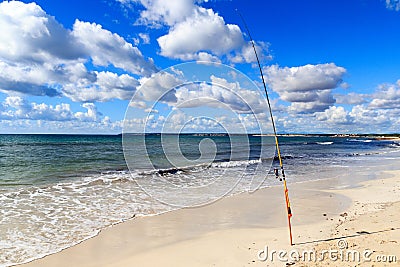 Fishing rod on Platja Es Trenc beach panorama and Mediterranean Sea on Majorca Stock Photo