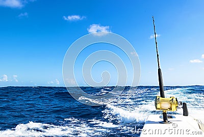 Fishing rod in a saltwater boat during fishery day in blue ocean Stock Photo