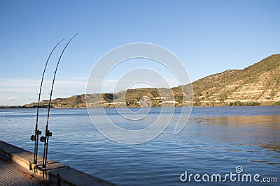 Fishing rods by the river Ebro Stock Photo