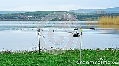 Fishing rods waiting for the byte on a lake Stock Photo