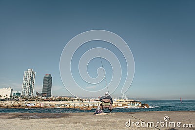 Fishing on the seashore of Barcelona Spain Editorial Stock Photo