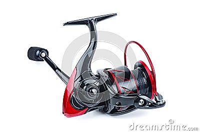 Fishing spining reel red and black color isolated on white Stock Photo