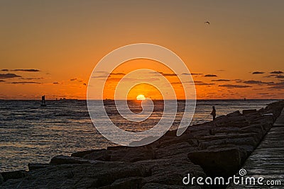 Fishing at sunrise Stock Photo