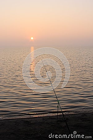 Fishing at sunrise on the river Stock Photo