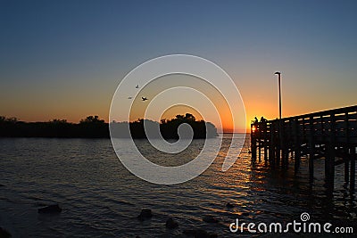 Fishing at Sunset Stock Photo