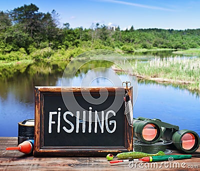 Fishing tackle and a blackboard Stock Photo