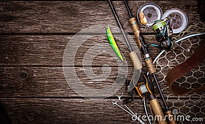 Fishing tackle composition, wood background. Stock Photo