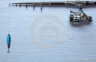 Fishing tackle - fishing spinning, hooks and lures on wooden background. Stock Photo