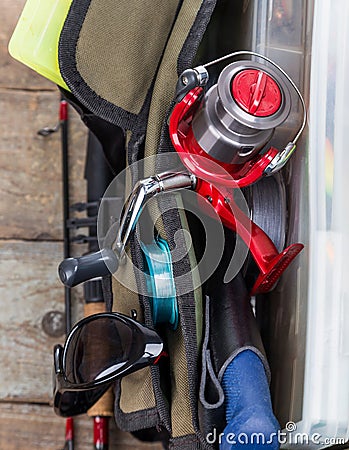 Fishing tackles and lures in open handbag Stock Photo
