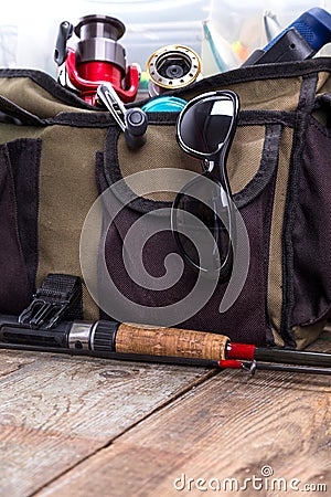 Fishing tackles and lures in open handbag Stock Photo