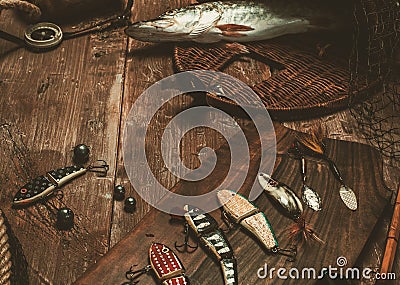 Fishing tools on a wooden table Stock Photo