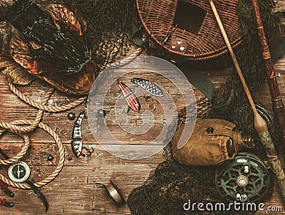 Fishing tools on a wooden table Stock Photo