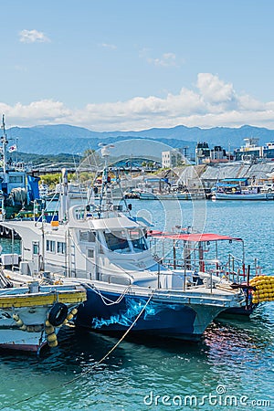 Fishing trawlers docked in calm water at Hupo seaport Editorial Stock Photo