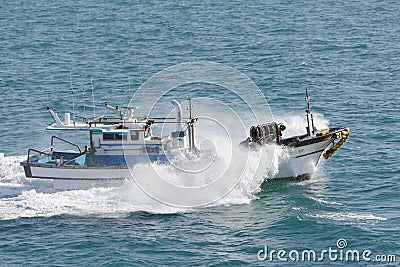 The fishing vessel in splashes Editorial Stock Photo