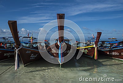 Fishing wooden rowing boats are parked on the beach on Koh Lipe, Thailand. Editorial Stock Photo